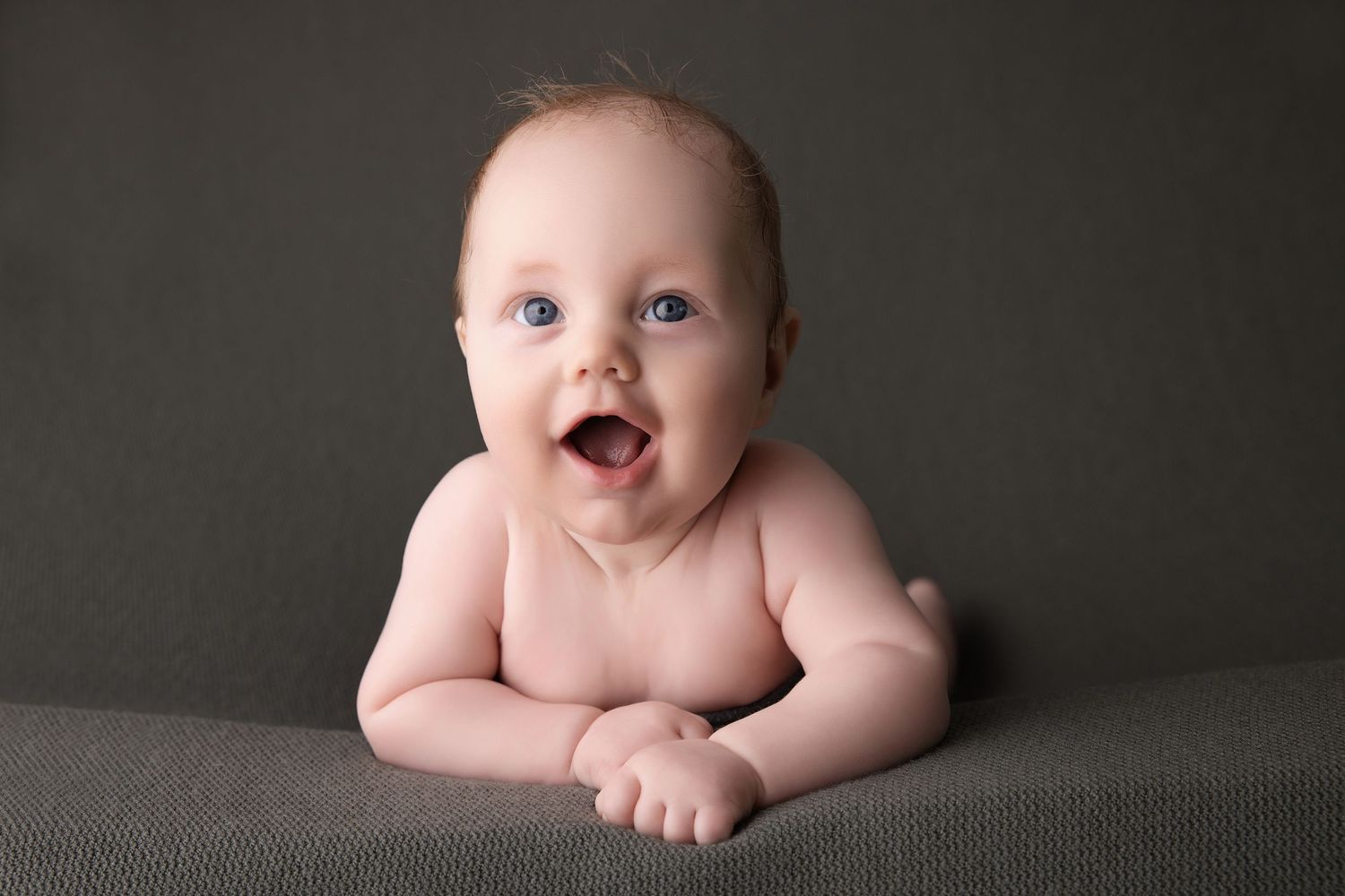 Newborn baby portraits showing different sleeping poses on soft gray backgrounds.