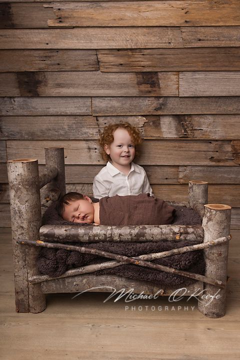 Rustic wooden bench made from birch logs and brown fabric cushion shown in progressive sleeping poses against barn wood wall.