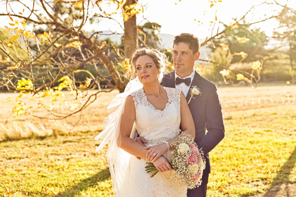 Sunset engagement photo session with golden light in natural outdoor setting.