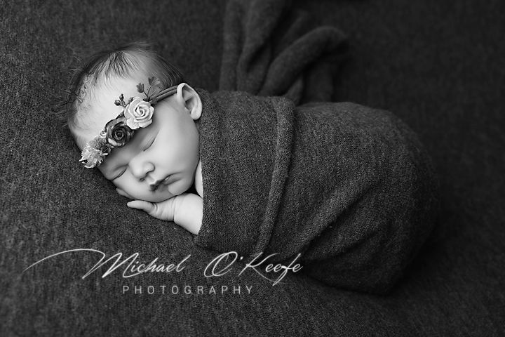 Artistic black and white photo series showing different facial expressions and poses in dramatic lighting.