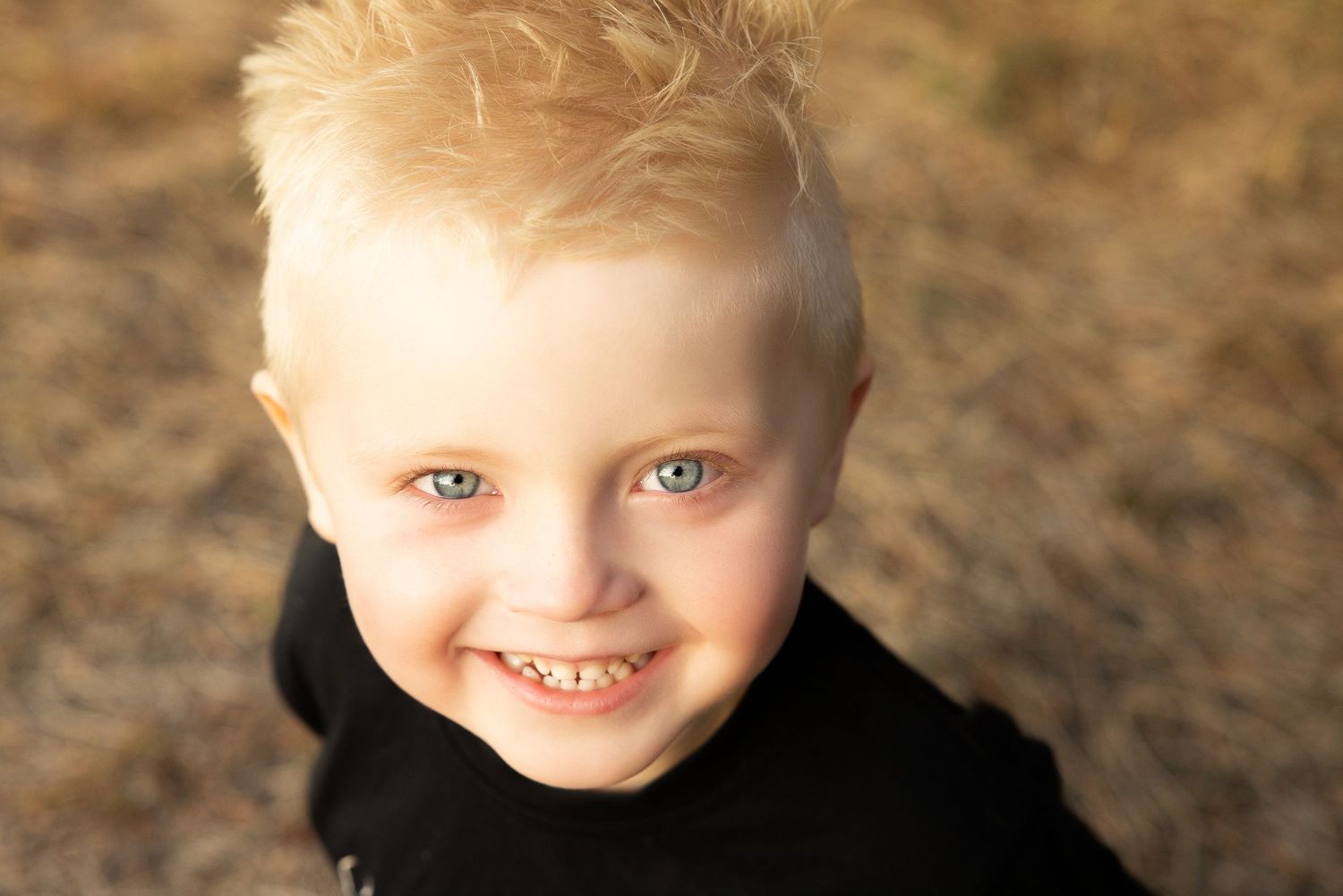 Children's outdoor portrait series showing natural expressions in warm sunlight.