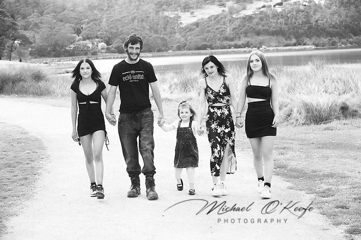 Black and white photo series showing people walking together on a path through natural outdoor settings.