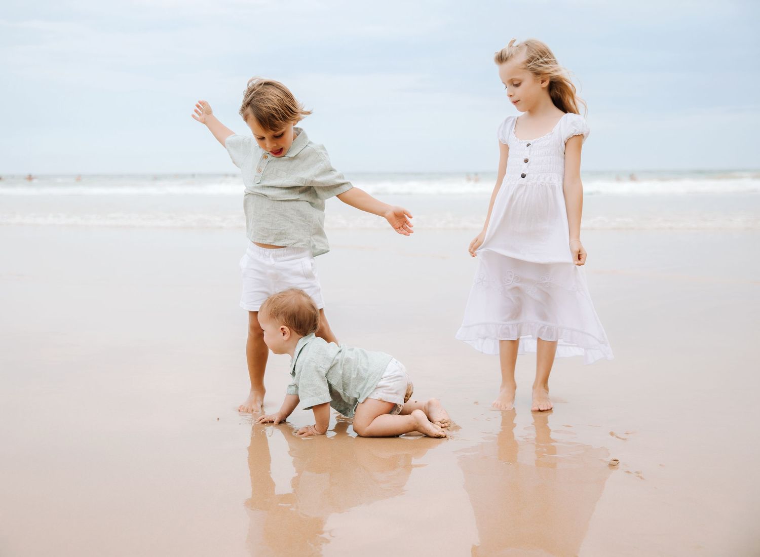 Siblings playing at the beach. Sydney Northern Beaches,