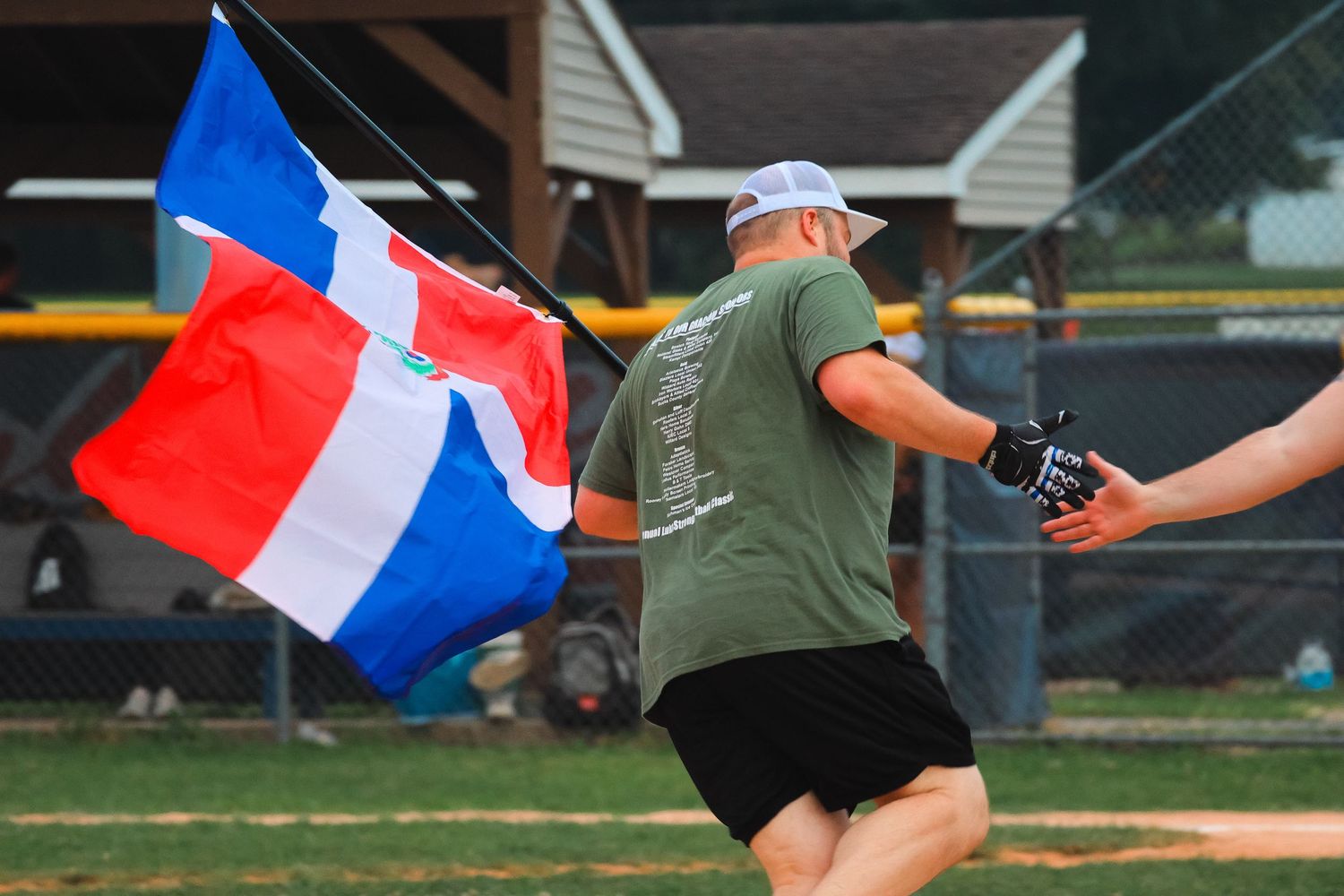 Lukestrong softball running with the flag.