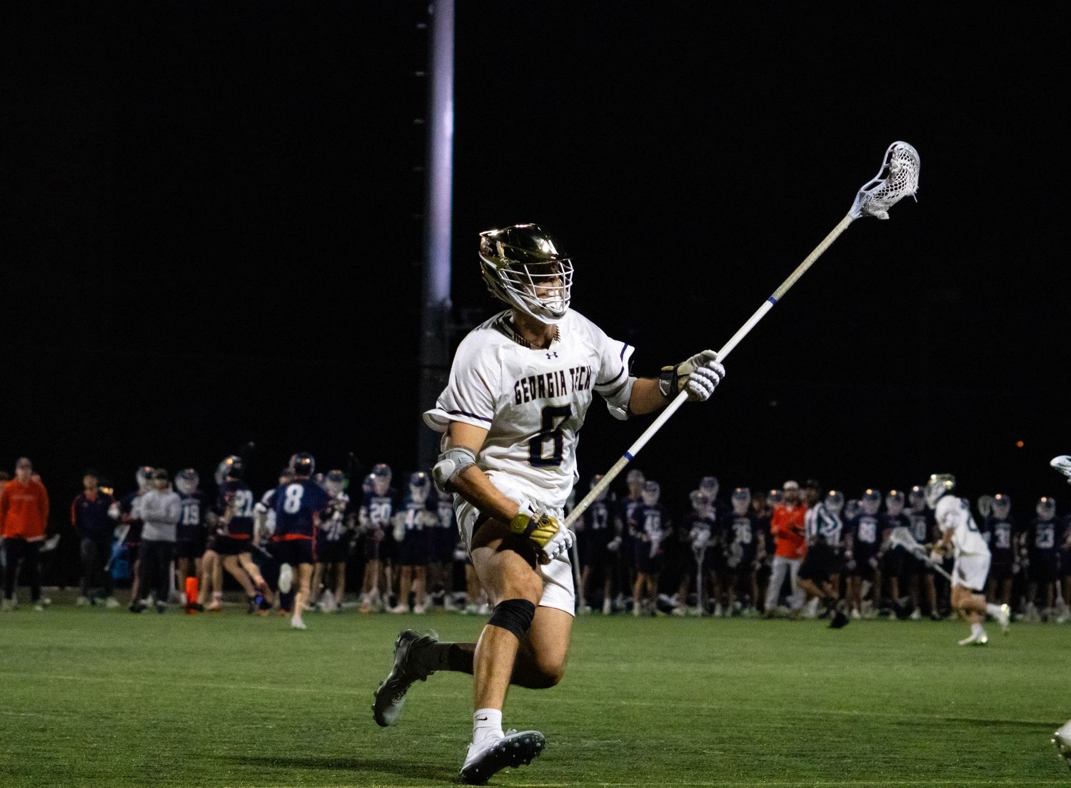 GT Lacrosse defense action.