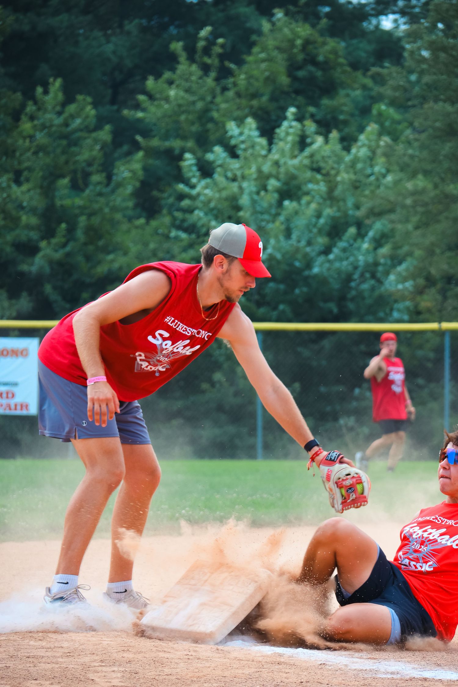 Lukestrong softball taking the base.