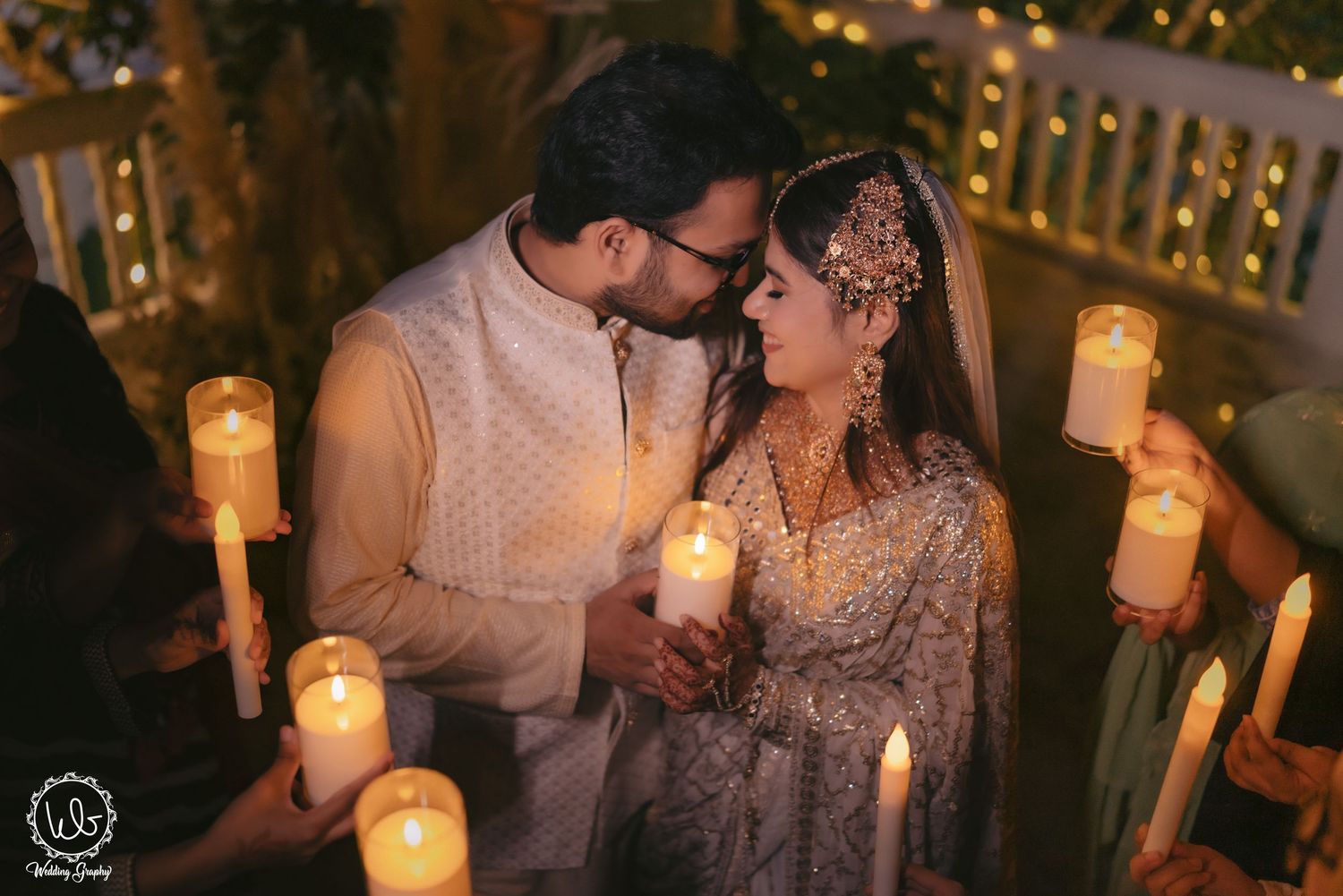Romantic candlelit wedding portraits with soft lighting and elegant decor.