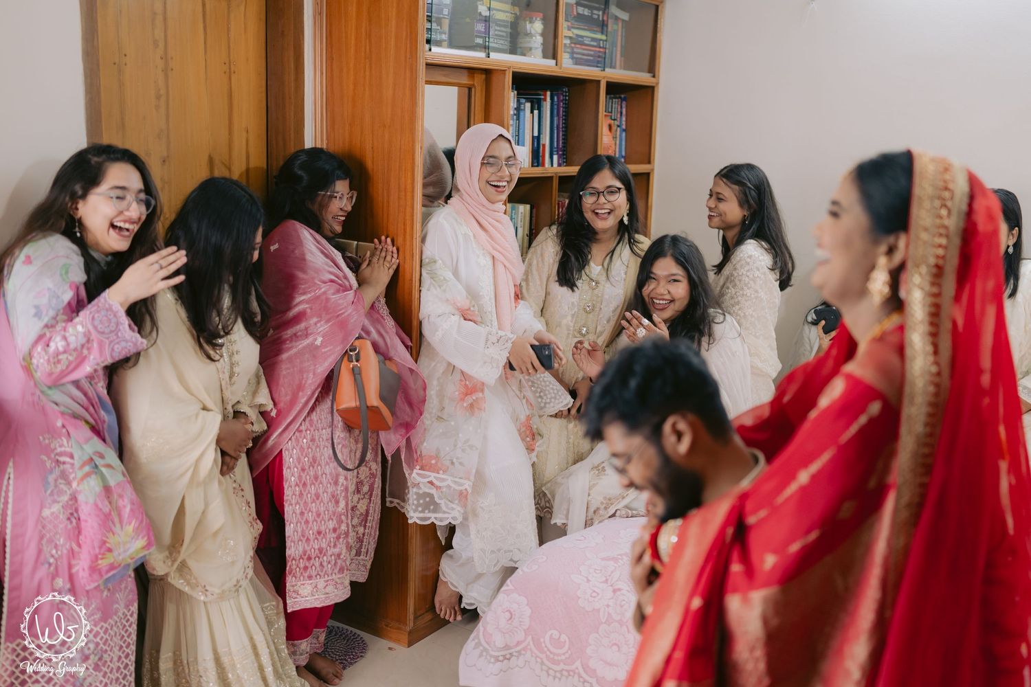 Wedding celebration with guests in traditional attire dancing and enjoying festivities.