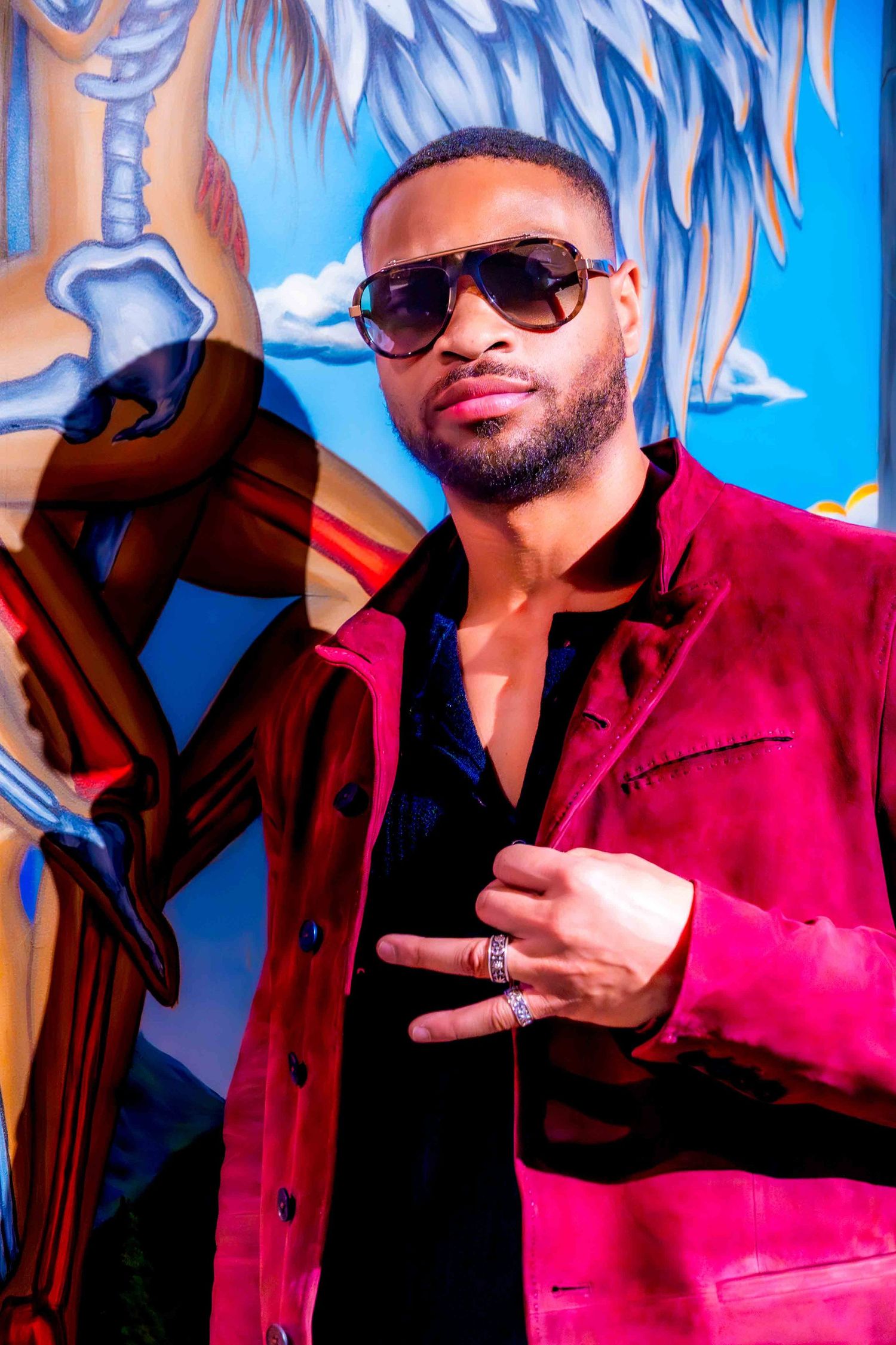 Artistic photo series with a person in red clothing posing against a blue and white backdrop.