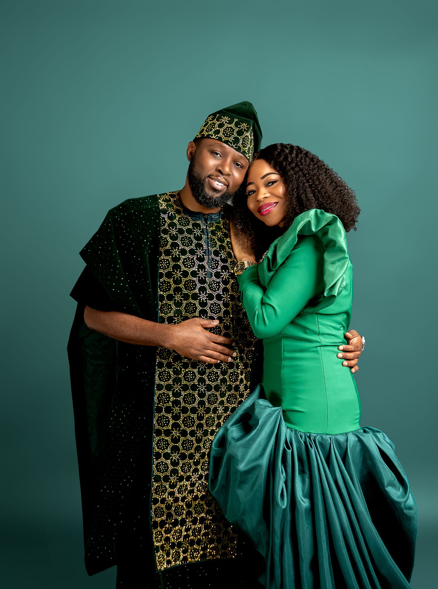 Intimate fashion portraits featuring emerald green dress and traditional patterned attire.