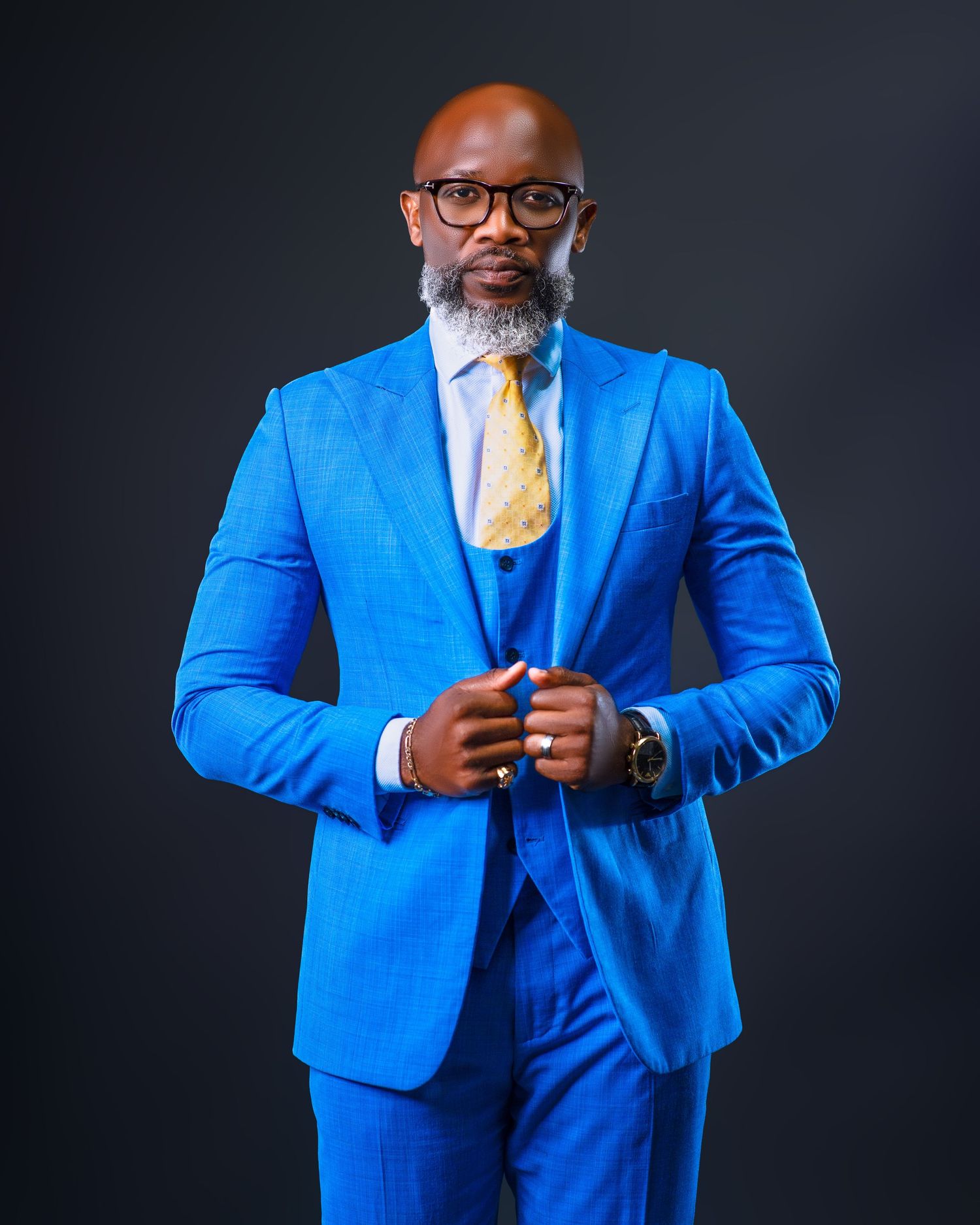 Bright blue suit ensemble with yellow tie photographed from various angles.
