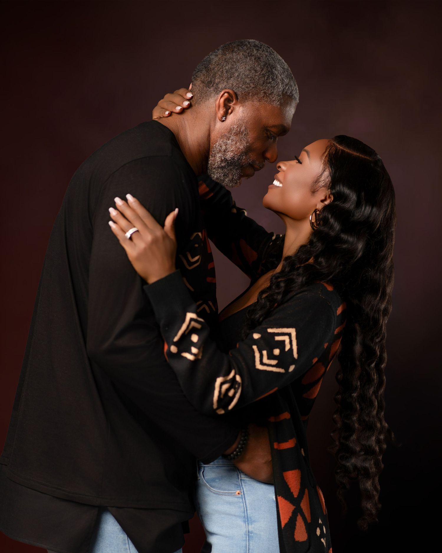 A romantic couple shares intimate moments in a series of dark moody portrait photos against a black background.