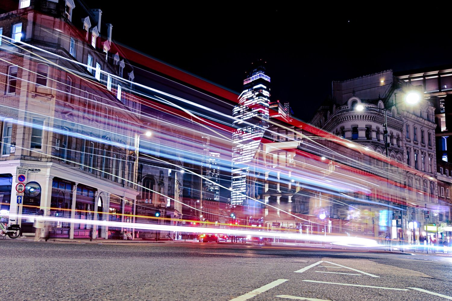 City bus light trails though the city as light trails photography available as fine art wall prints.