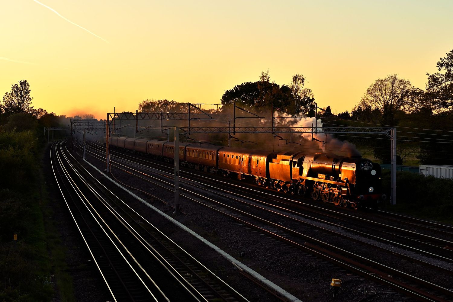 £4028 Eddystone steam locomotive heading towards London during sunset as scenic railway photography are available as wall art prints.