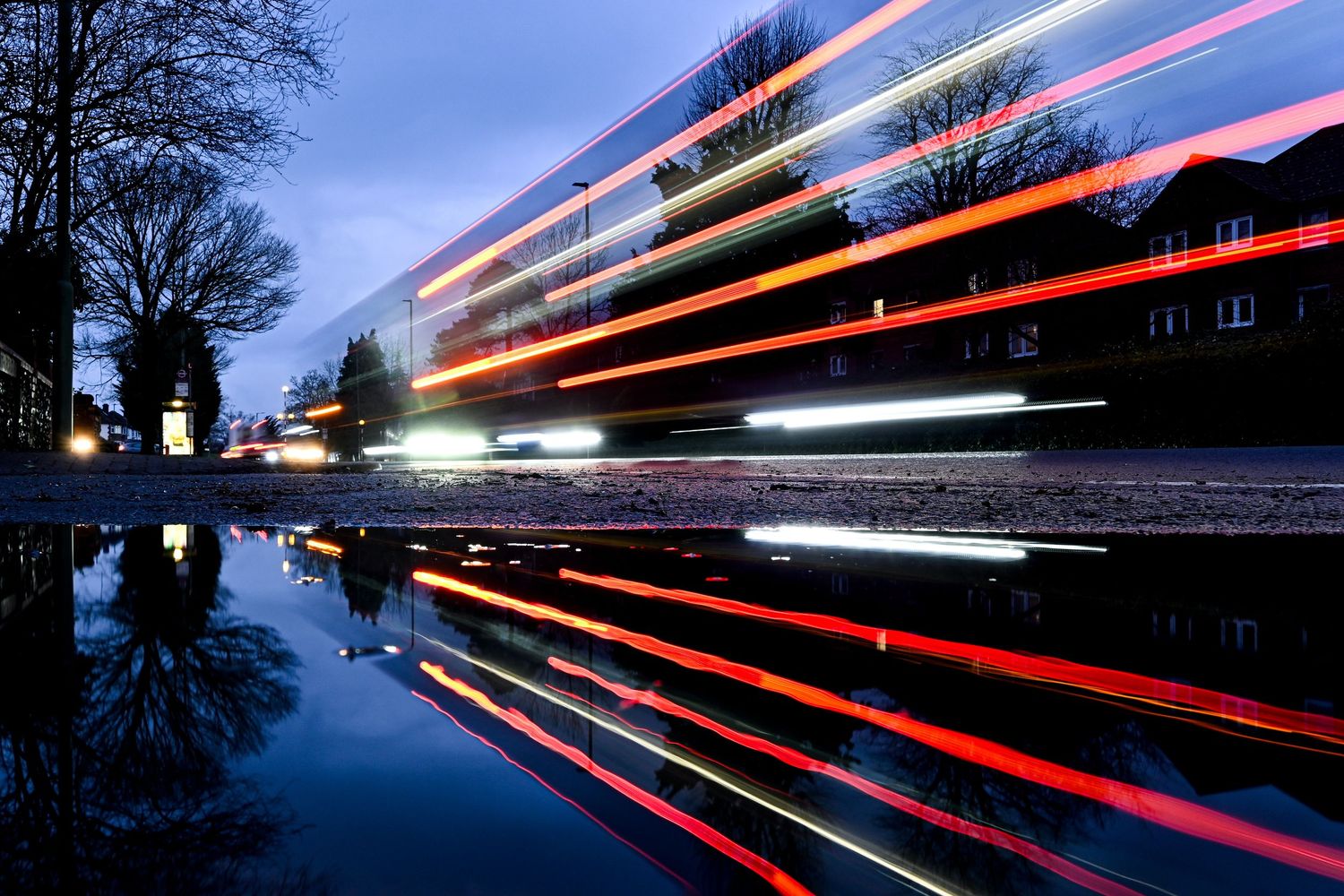Single decker bus Light trail reflection as light trails photography available as fine art wall prints.