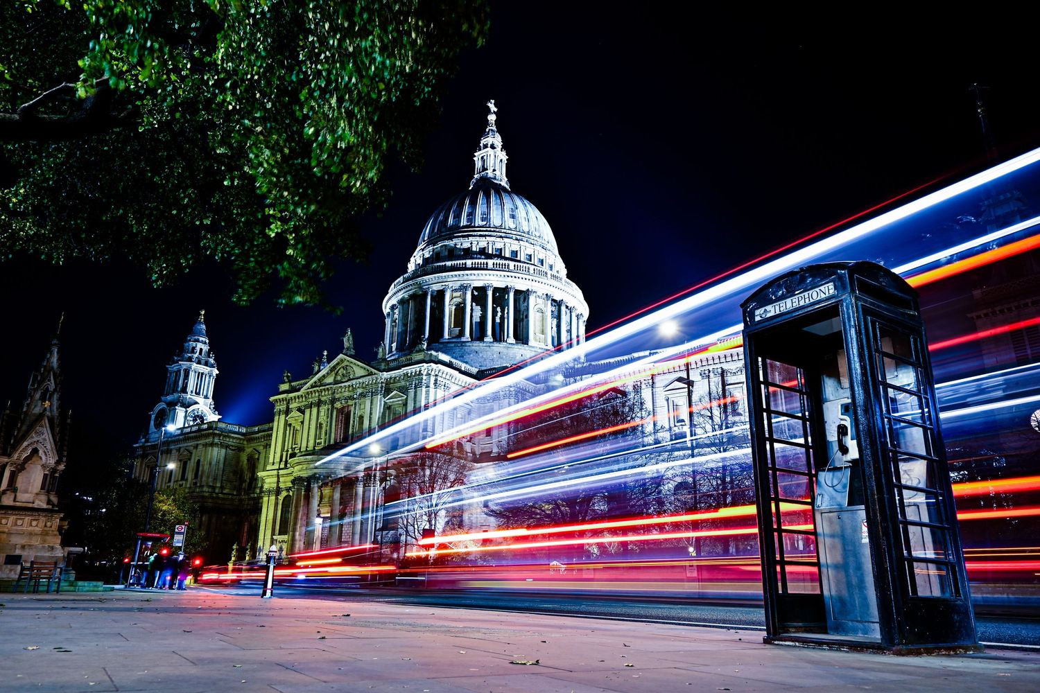 City bus light trails through St Pauls Cathedral as light trails photography available as fine art wall prints.