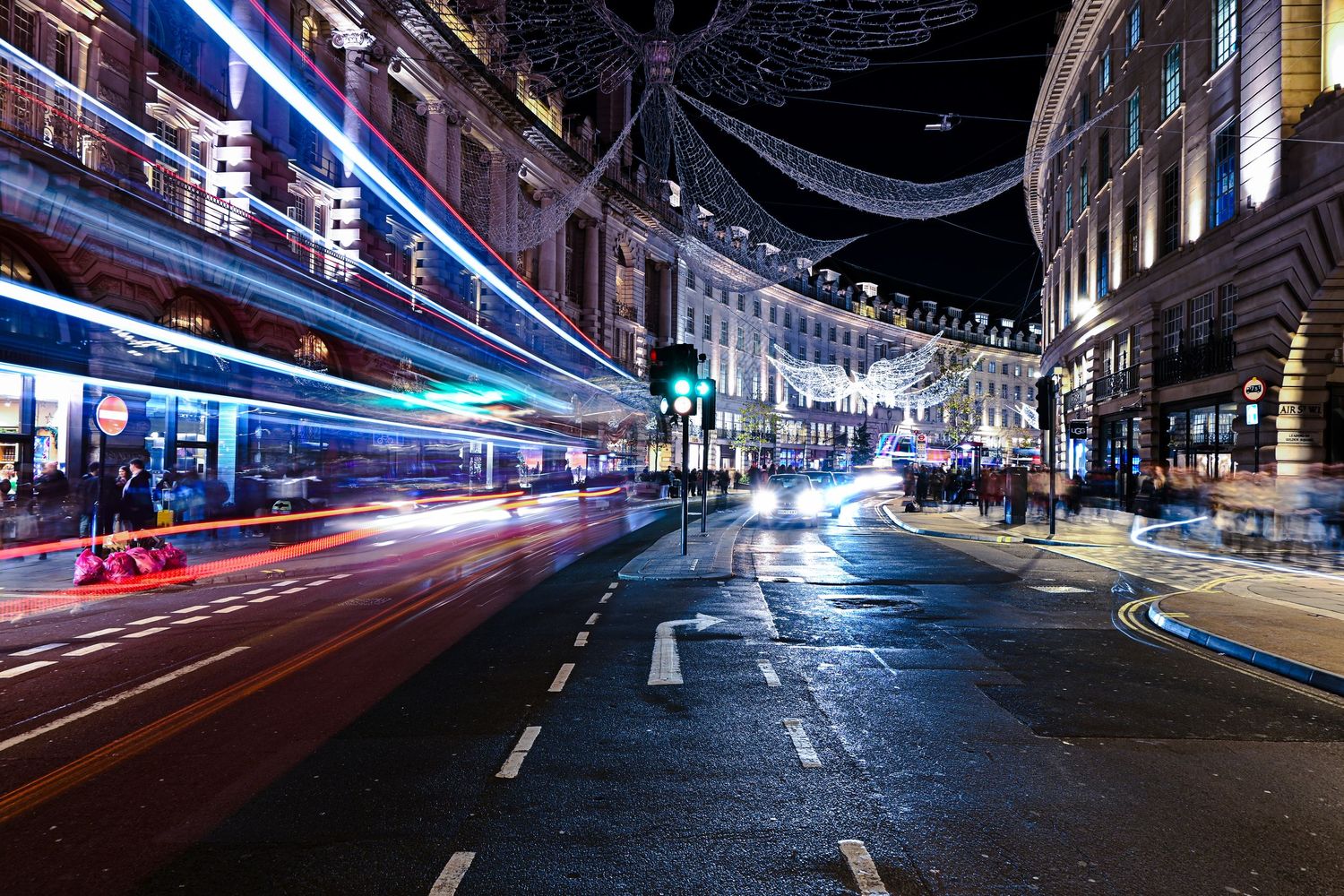 Vehicles passes Piccadilly Circus as light trails photography available as fine art wall prints.