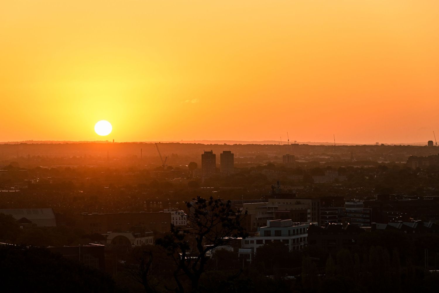 Sun rising from the horizon at Alexandra palace as landscape photography available as fine art wall prints.