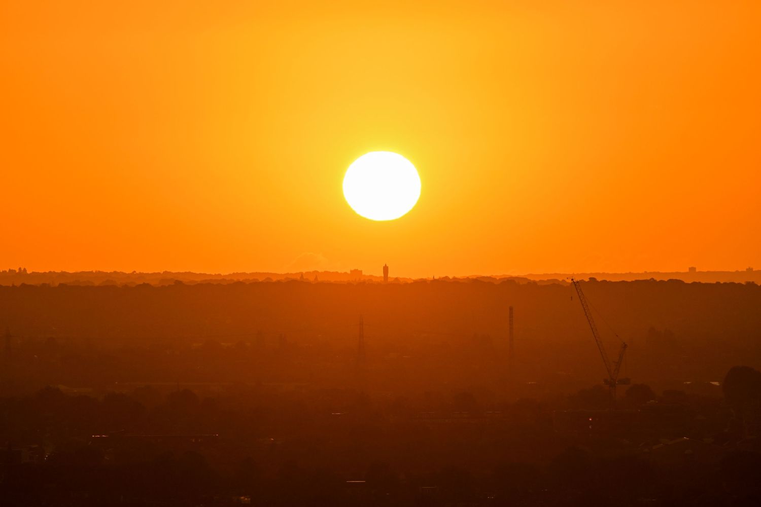 The rising sun from the horizon at Alexandra Palace as landscape photography available as fine art wall prints.