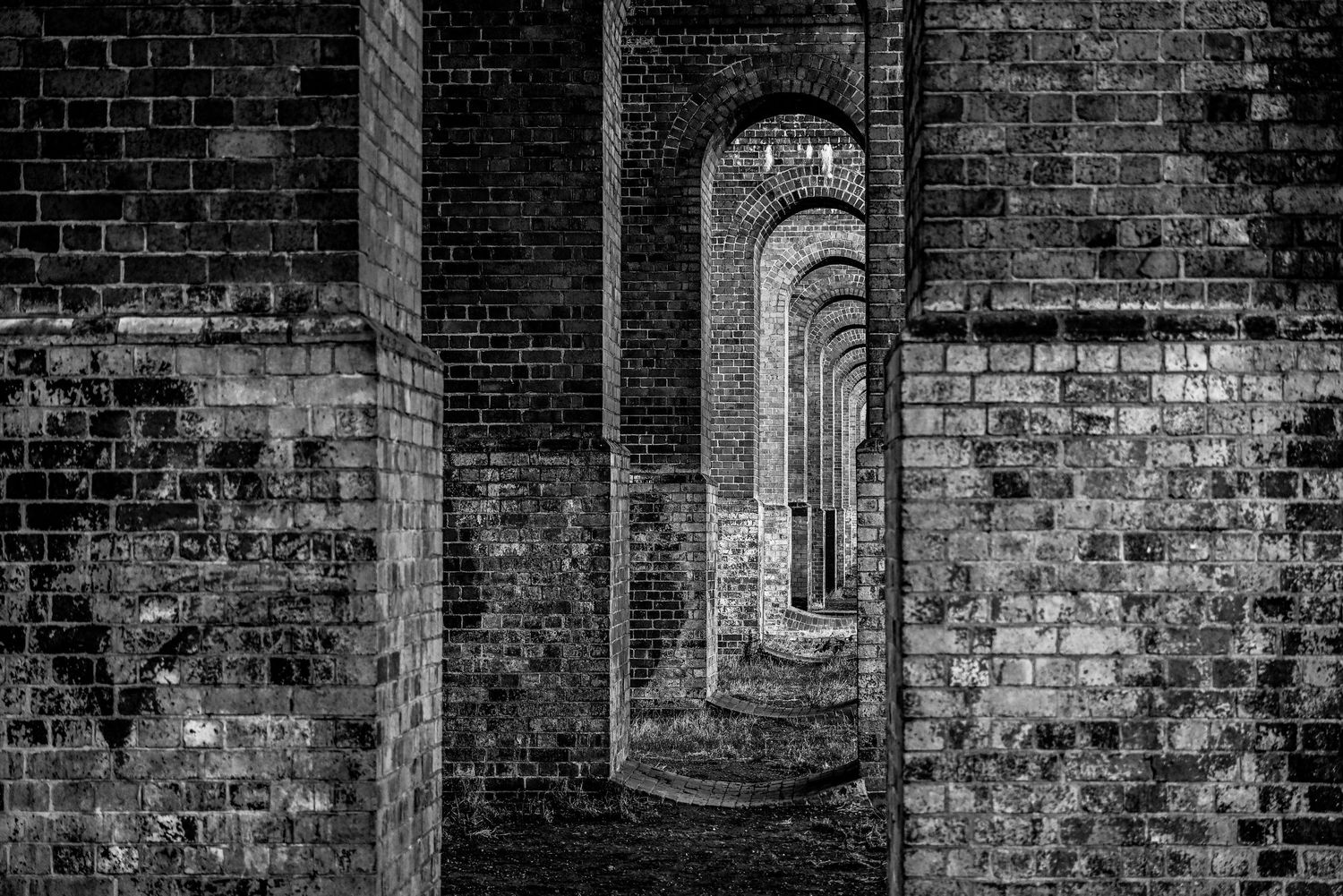 Sun light touches Arnos Viaduct as viaduct black & white photography available as fine art prints and gallery frame.