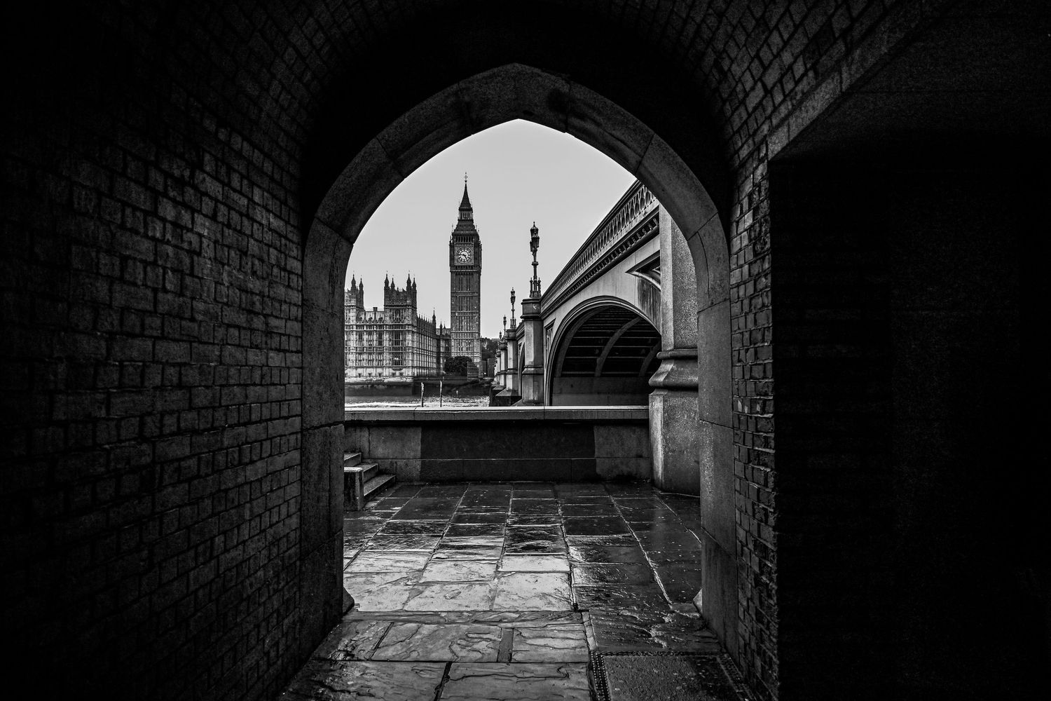 Big Ben & Westminster bridge during a cloudy day as black & white city photography available as fine art wall prints.