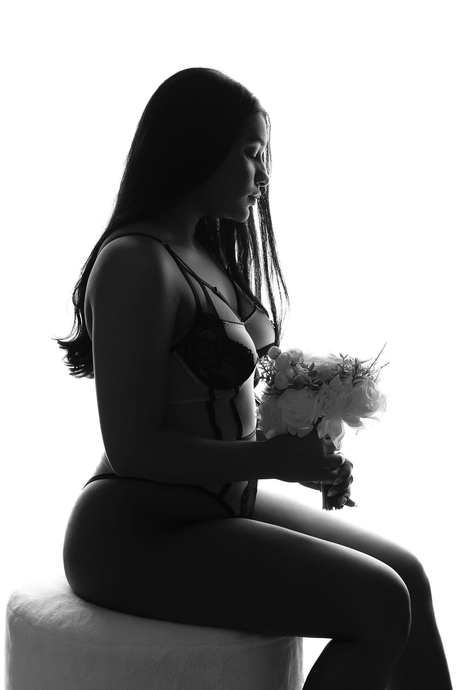 Black and white portrait capturing innocence and subtle sensuality, with artistic and elegant styling