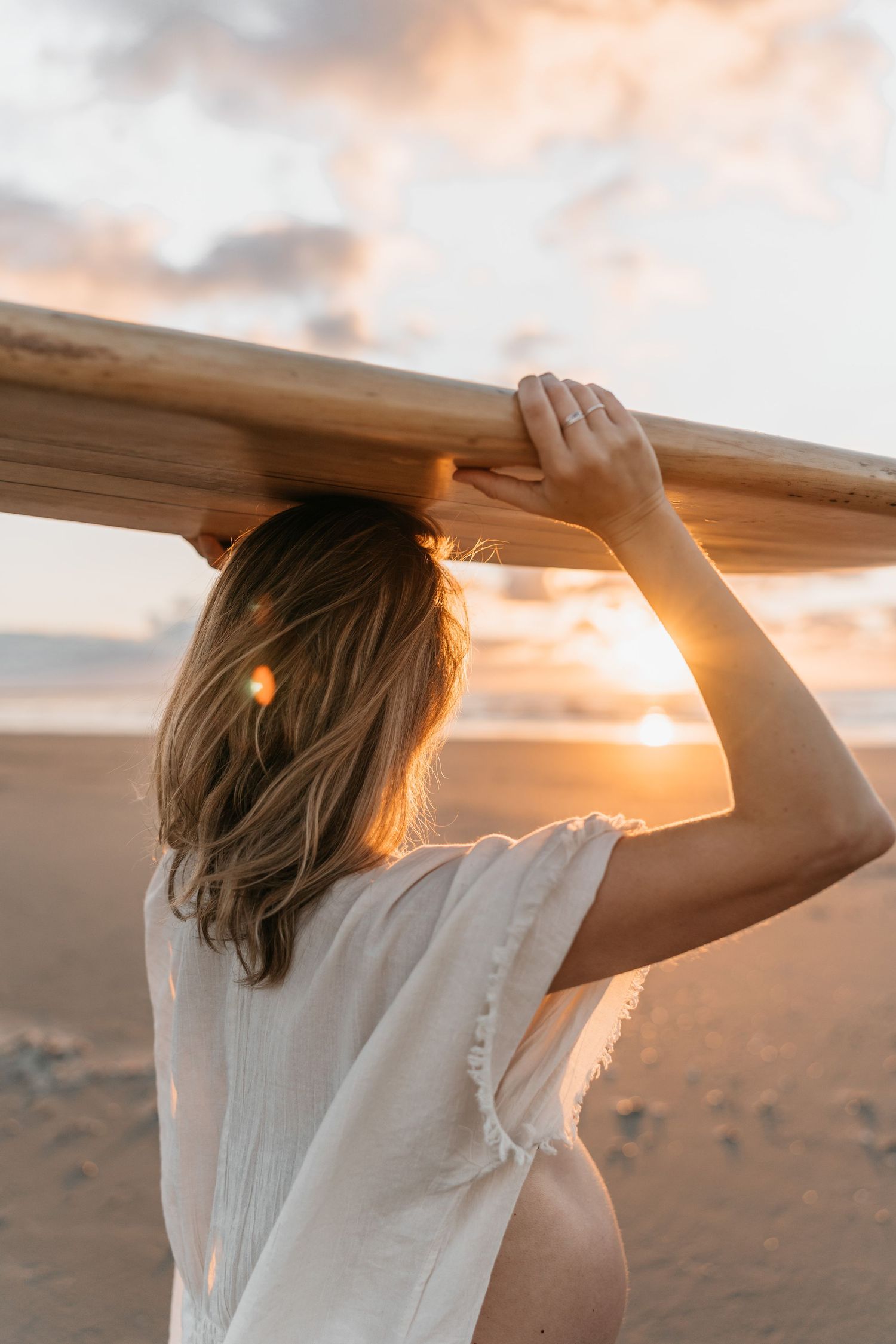 Surfer girl with surfboard