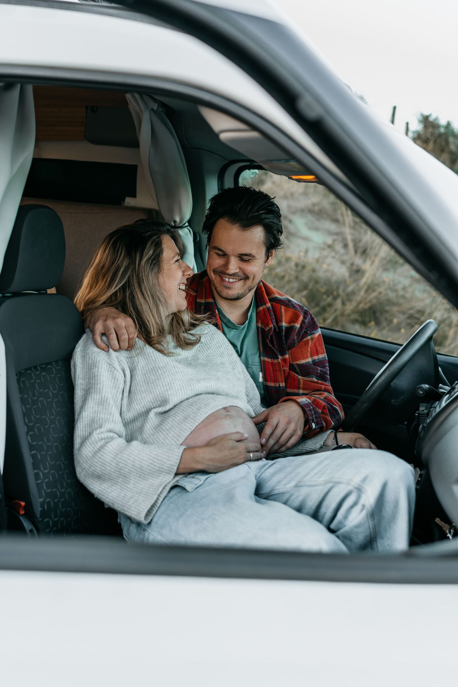 Maternity shoot adventurous couple in campervan