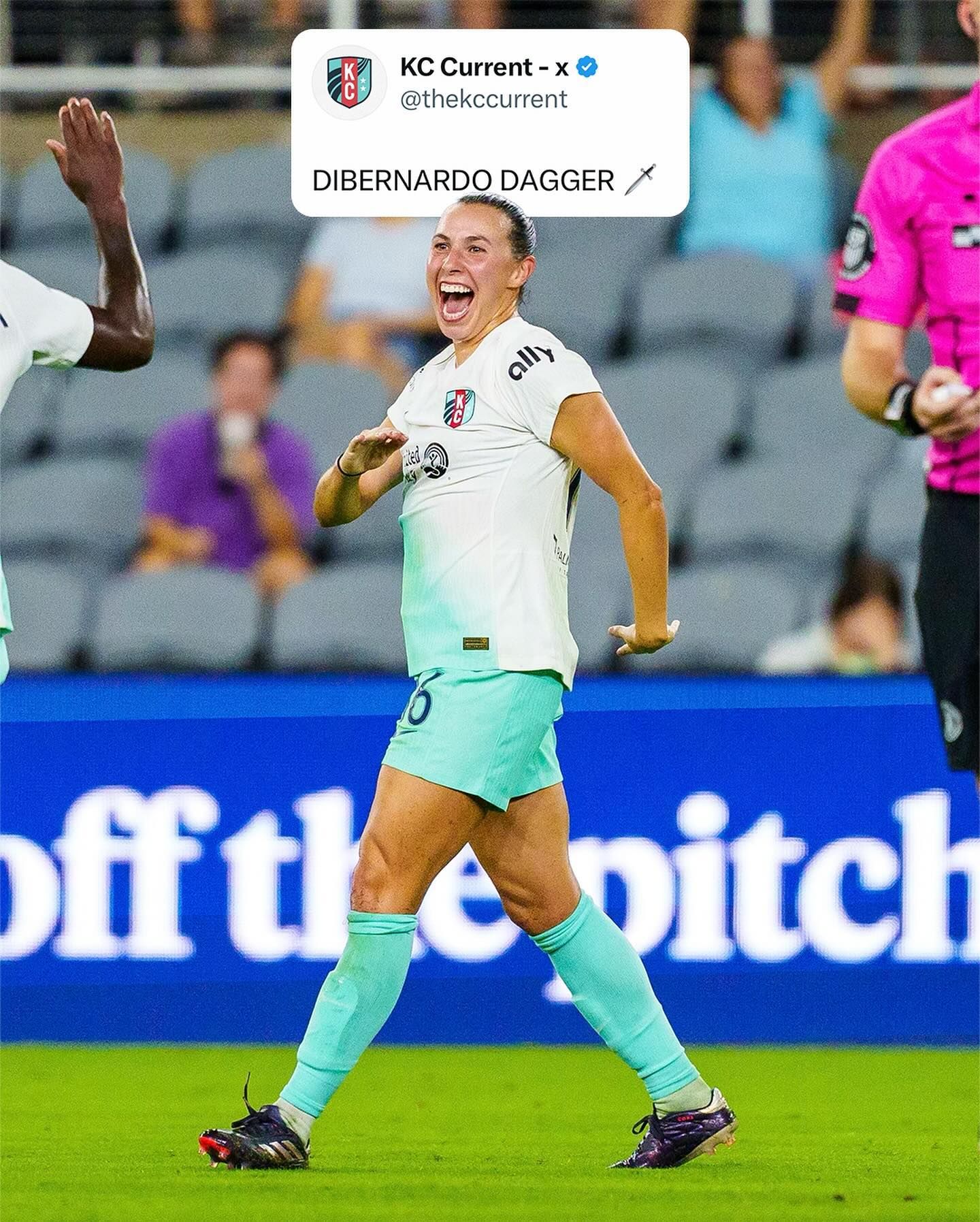 Soccer player celebrates goal in light blue uniform during KC Current match.