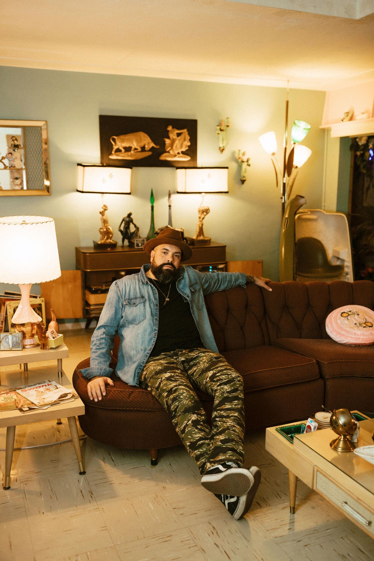 A sequence of four photos showing a person relaxing on a brown couch in a warmly lit living room.