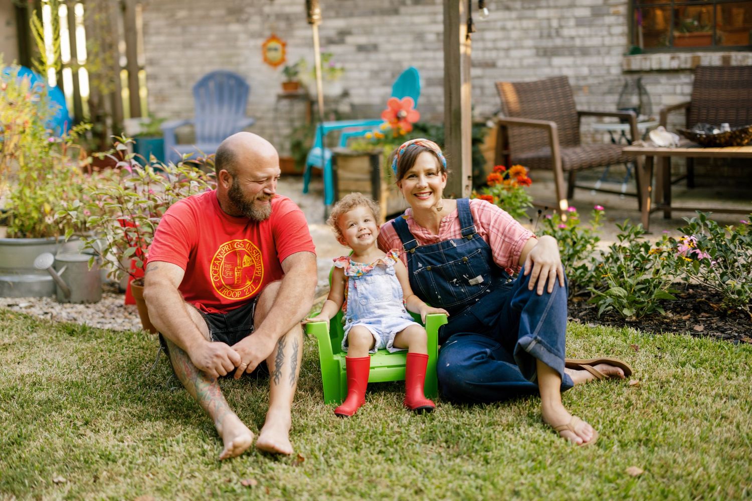 Family enjoying a relaxing summer day together in the backyard garden.