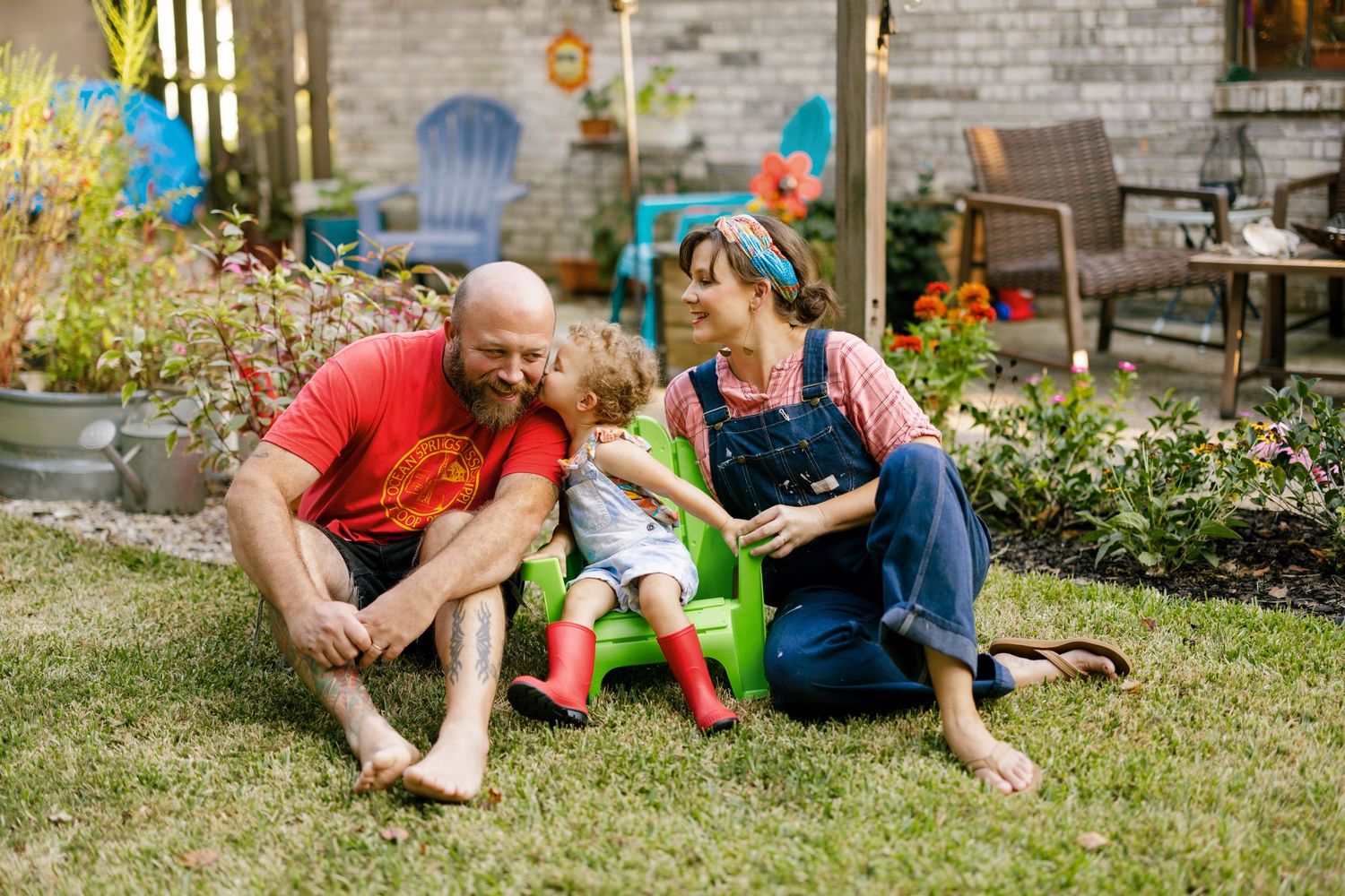 Three candid outdoor shots show playful moments with people relaxing on grass in a garden setting.
