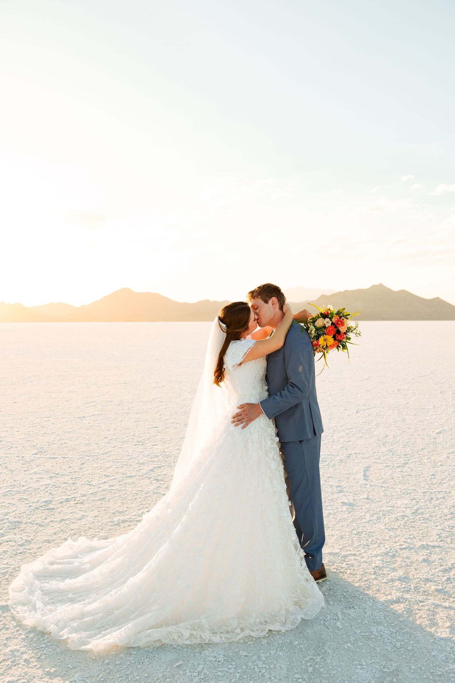 Bride and groom at The Bonneville Salt Flats photography by Av Potter Photo a Utah wedding and lifestyle photographer