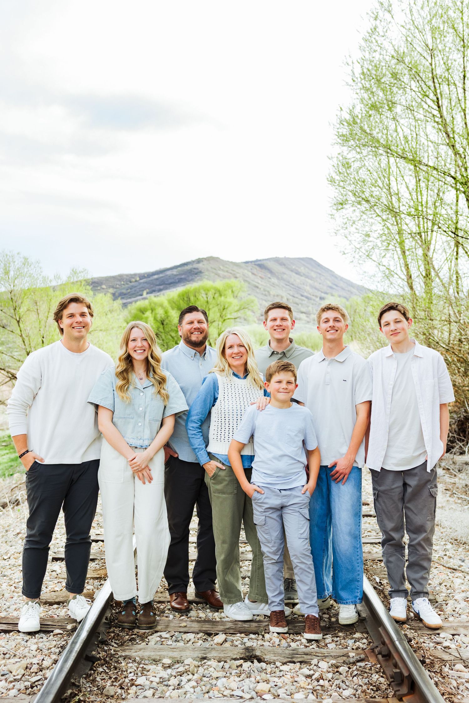 Family on train tracks at Historic Tate Barn photography by Av Potter Photo a Utah wedding and lifestyle photographer