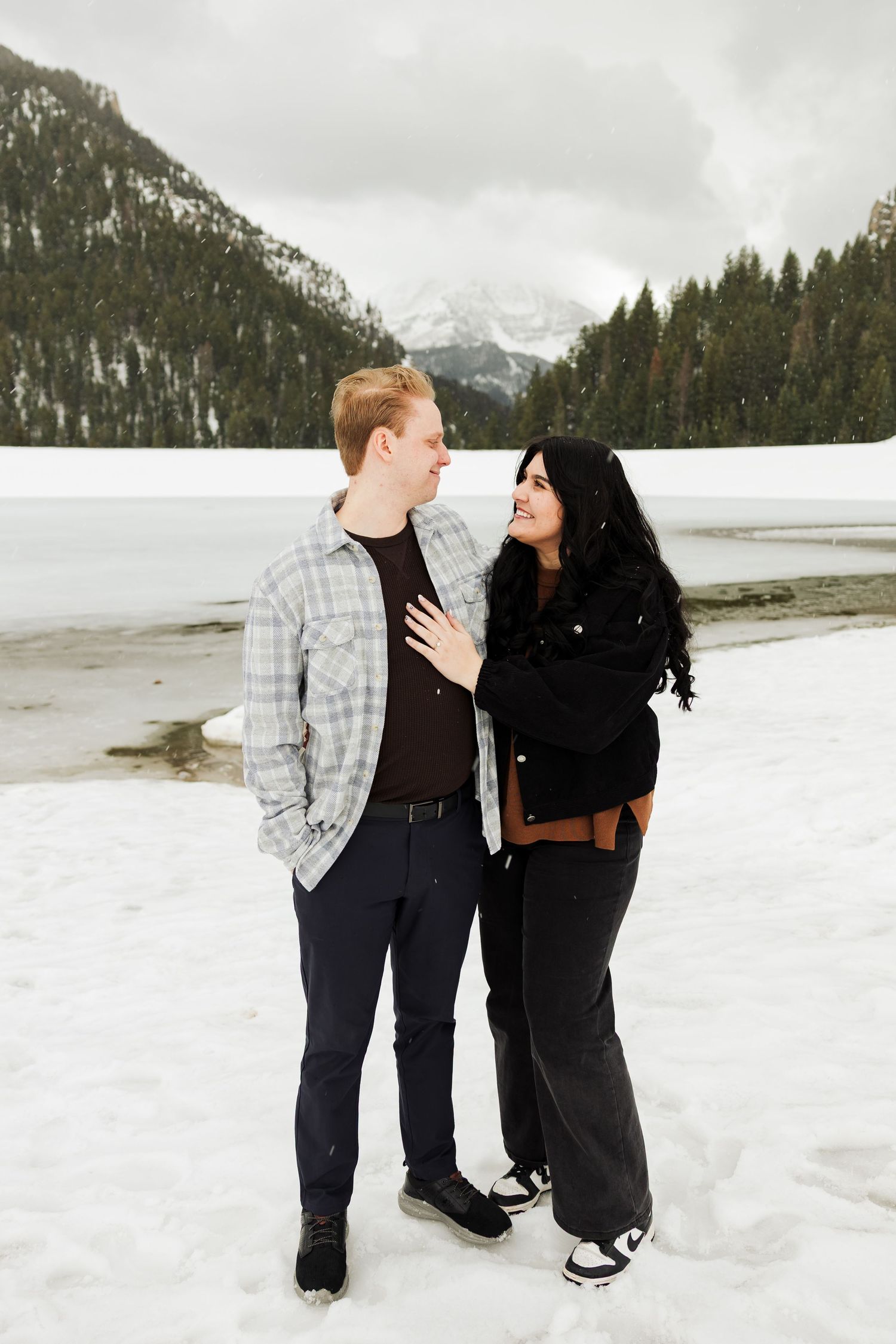 Couple hugging at Tibble Fork Reservoir photography by Av Potter Photo a Utah wedding and lifestyle photographer
