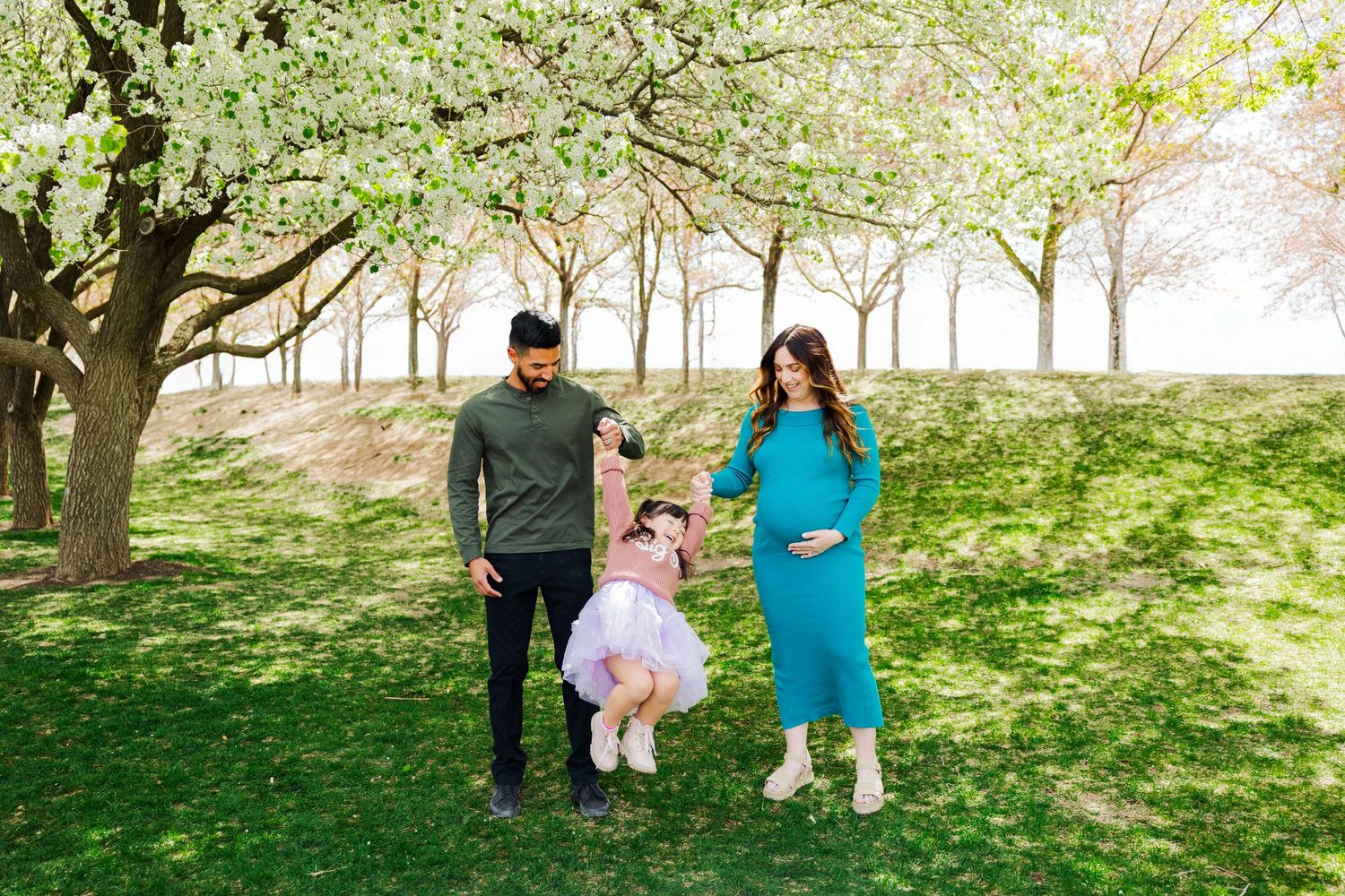 Family during cherry blossoms at The Utah State Capitol photography by Av Potter Photo a Utah wedding and lifestyle photographer