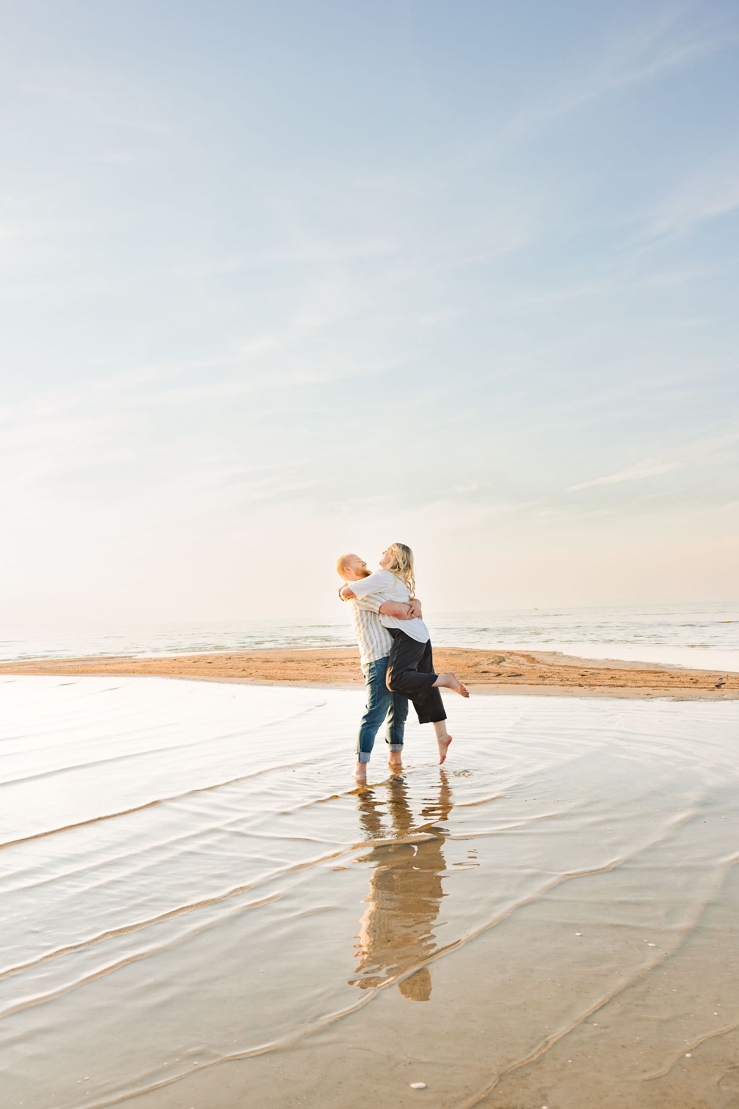 Couple hugging in lake at The Great Salt Lake photography by Av Potter Photo a Utah wedding and lifestyle photographer
