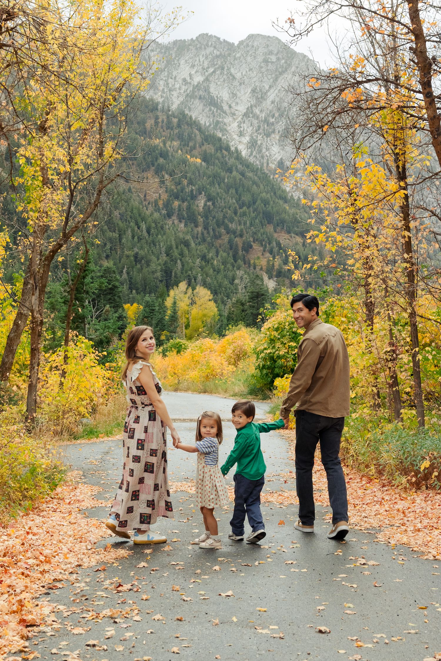 Family holding hands and walking at Tanner's Flat Campground photography by Av Potter Photo a Utah wedding and lifestyle photographer