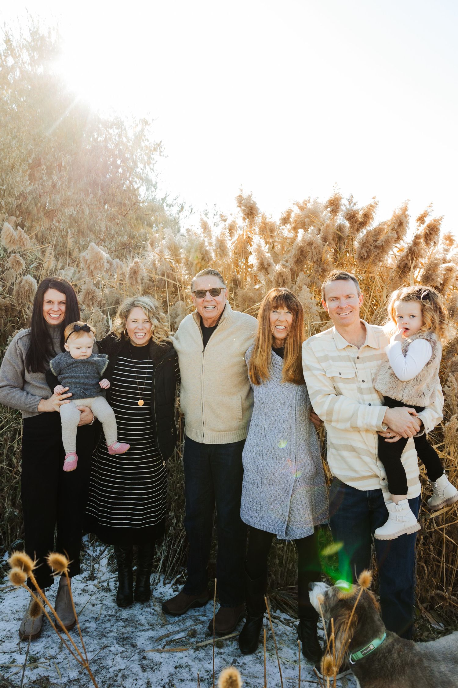 Family with dog during winter at Tunnel Springs Park photography by Av Potter Photo a Utah wedding and lifestyle photographer