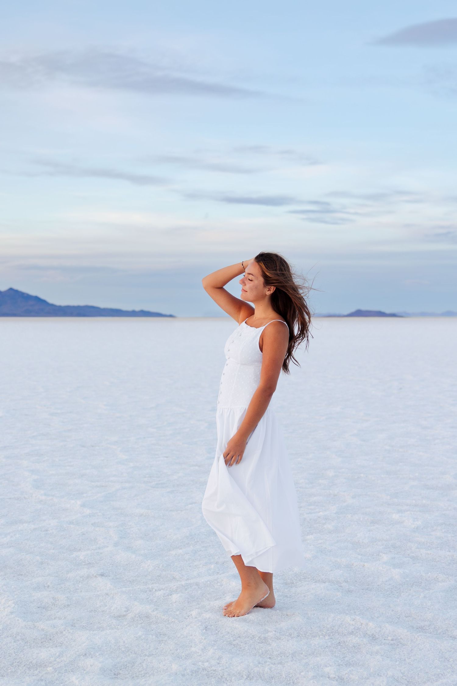 Senior photos at the Salt Flats in Wendover, Utah photography by Av Potter Photo a Utah wedding and lifestyle photographer