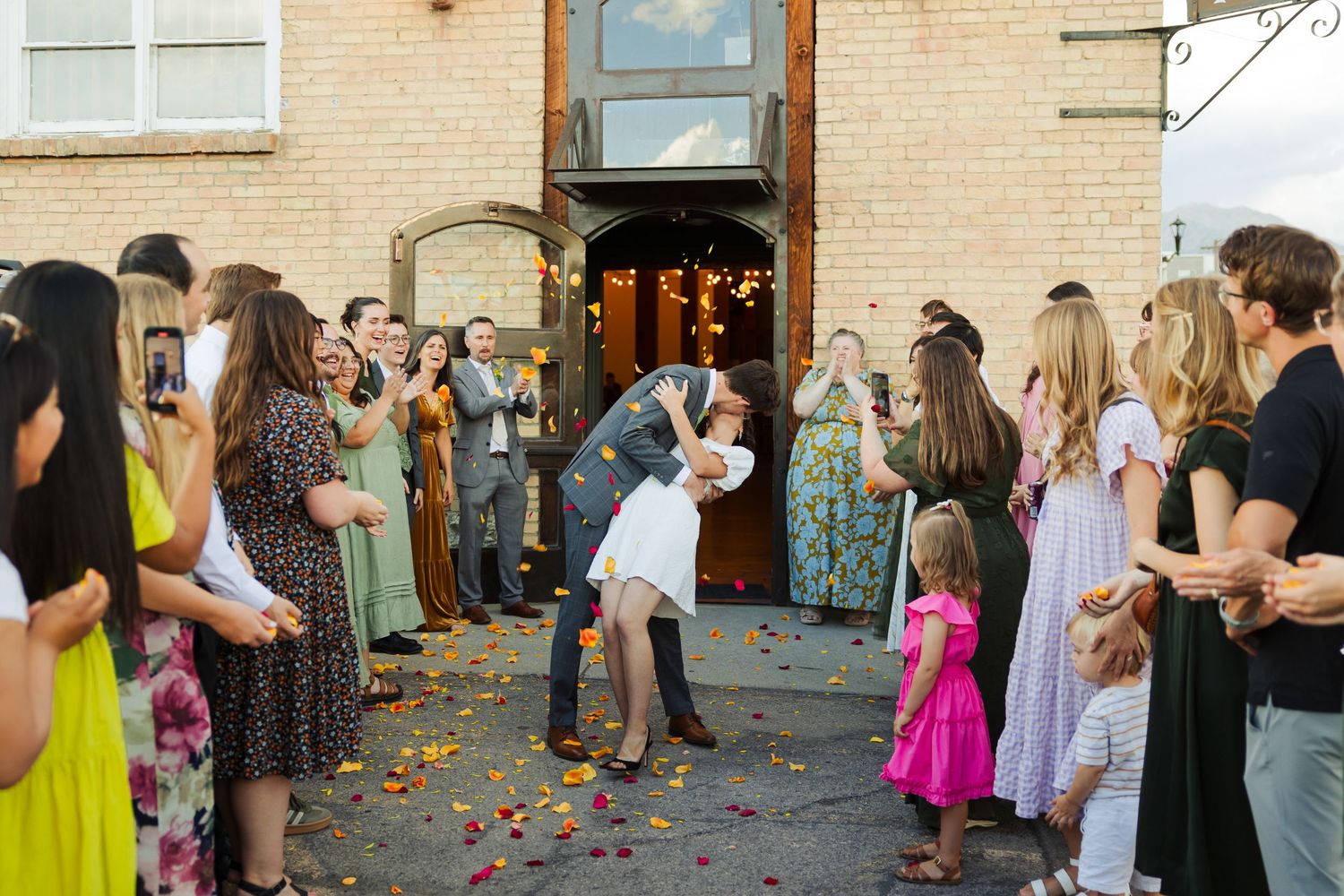 Bride and groom during send off at The Startup Budiling photography by Av Potter Photo a Utah wedding and lifestyle photographer