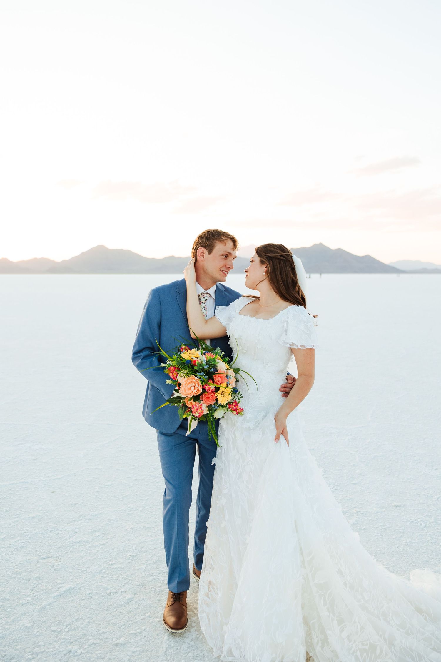 Bride and groom at The Bonneville Salt Flats photography by Av Potter Photo a Utah wedding and lifestyle photographer