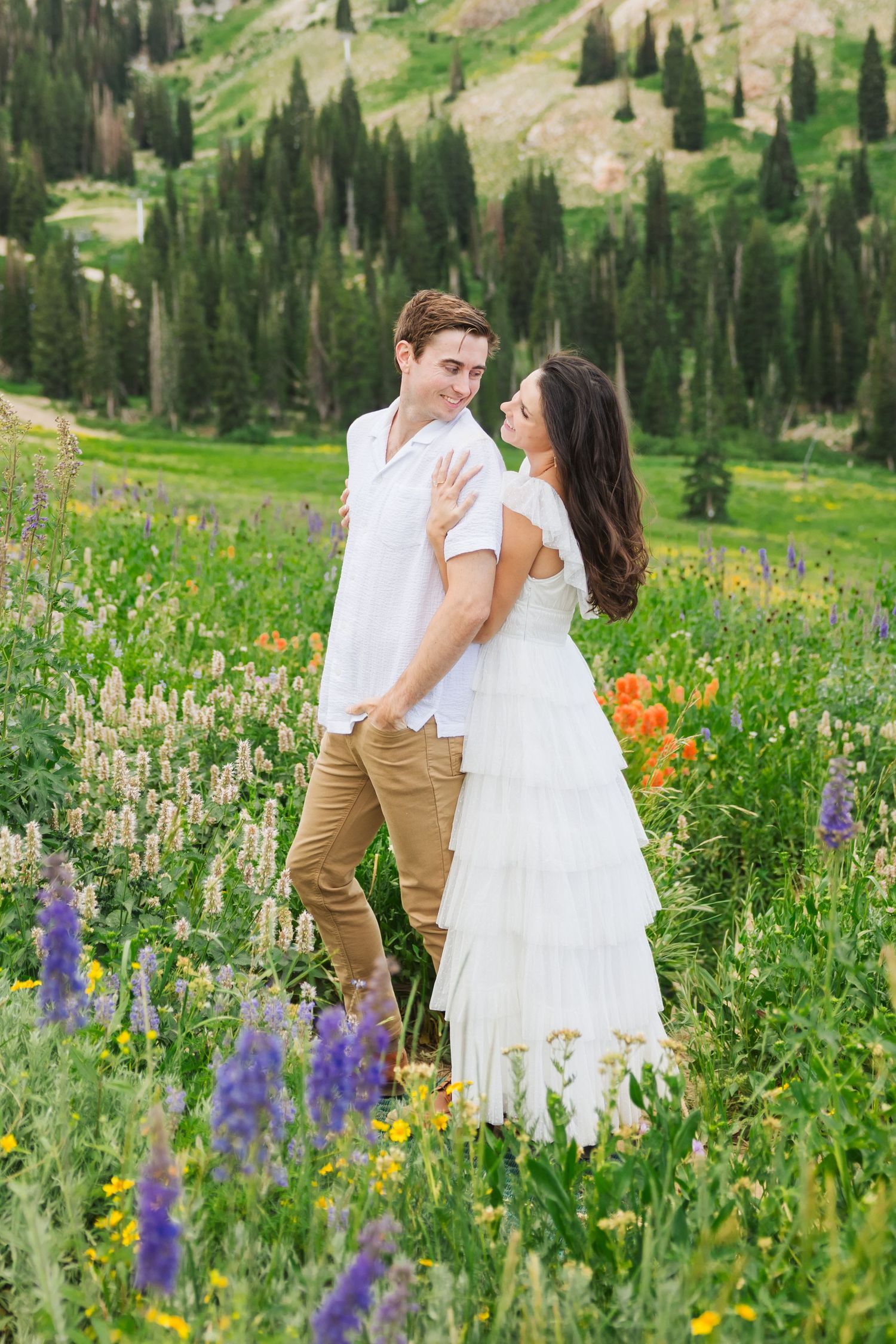 Couple in flower field at Albion Basin photography by Av Potter Photo a Utah wedding and lifestyle photographer