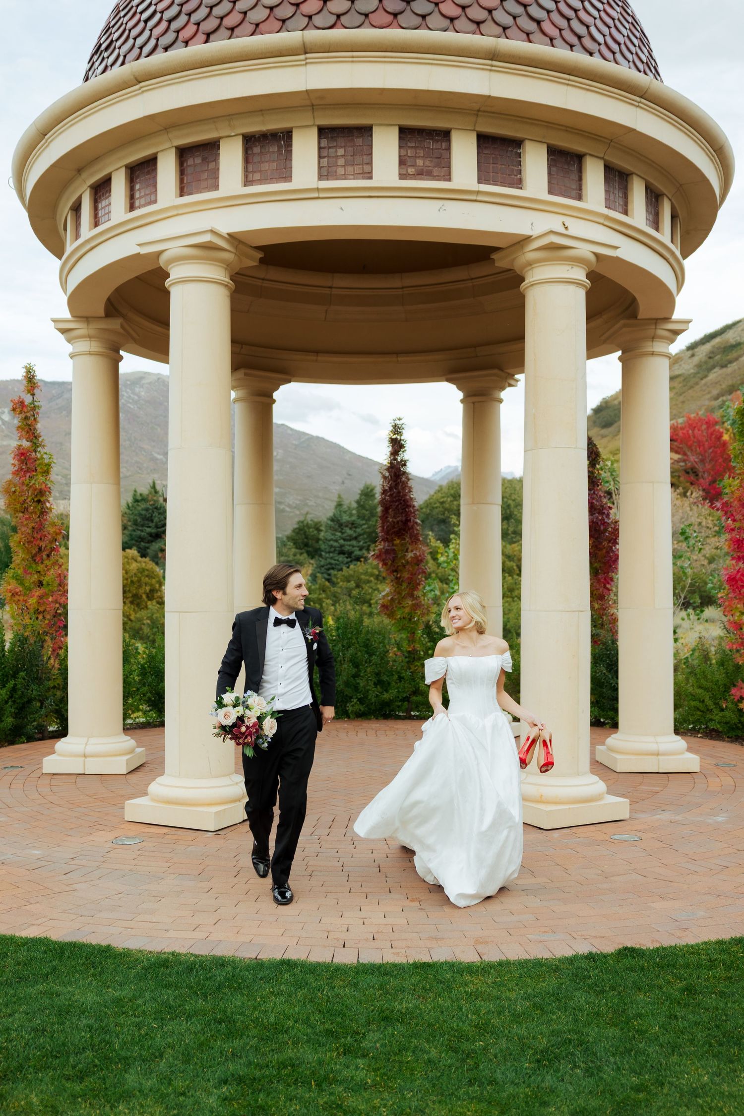 Bride and groom running at Siempre photography by Av Potter Photo a Utah wedding and lifestyle photographer