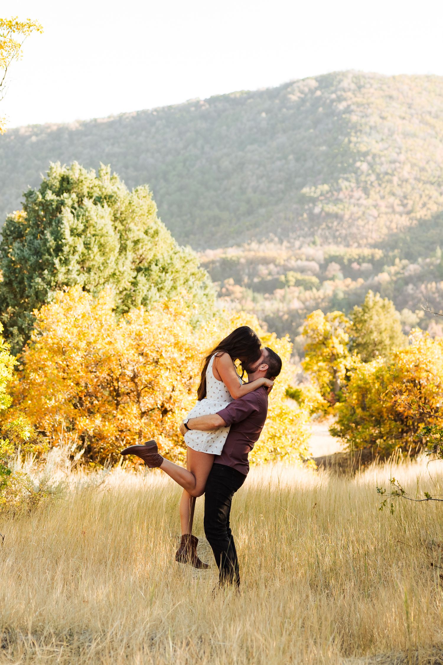 Couple at Old Snow Basin Road during fall photography by Av Potter Photo a Utah wedding and lifestyle photographer