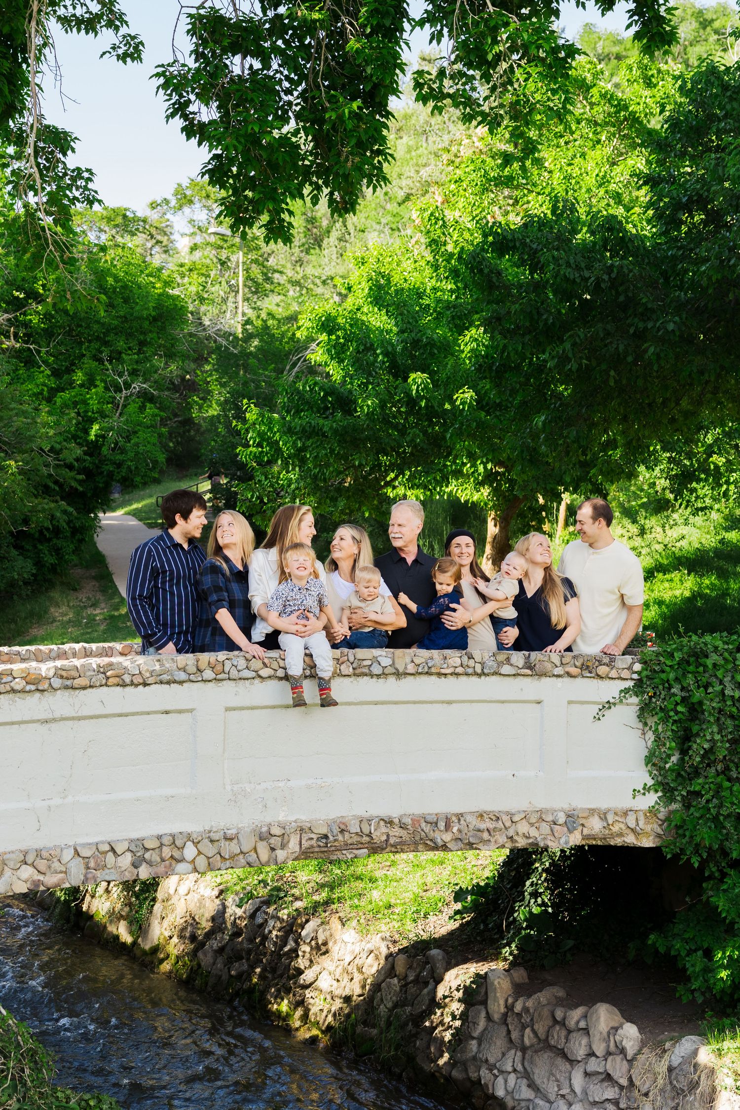 Family on bridge at Memory Grove Park photography by Av Potter Photo a Utah wedding and lifestyle photographer