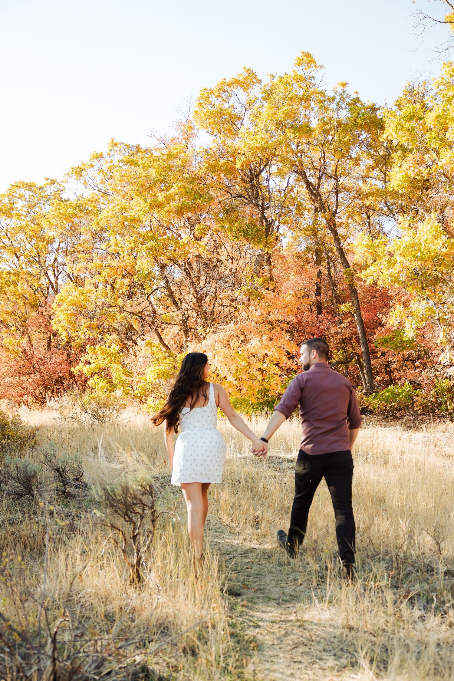 Couple at Old Snow Basin Road during fall photography by Av Potter Photo a Utah wedding and lifestyle photographer
