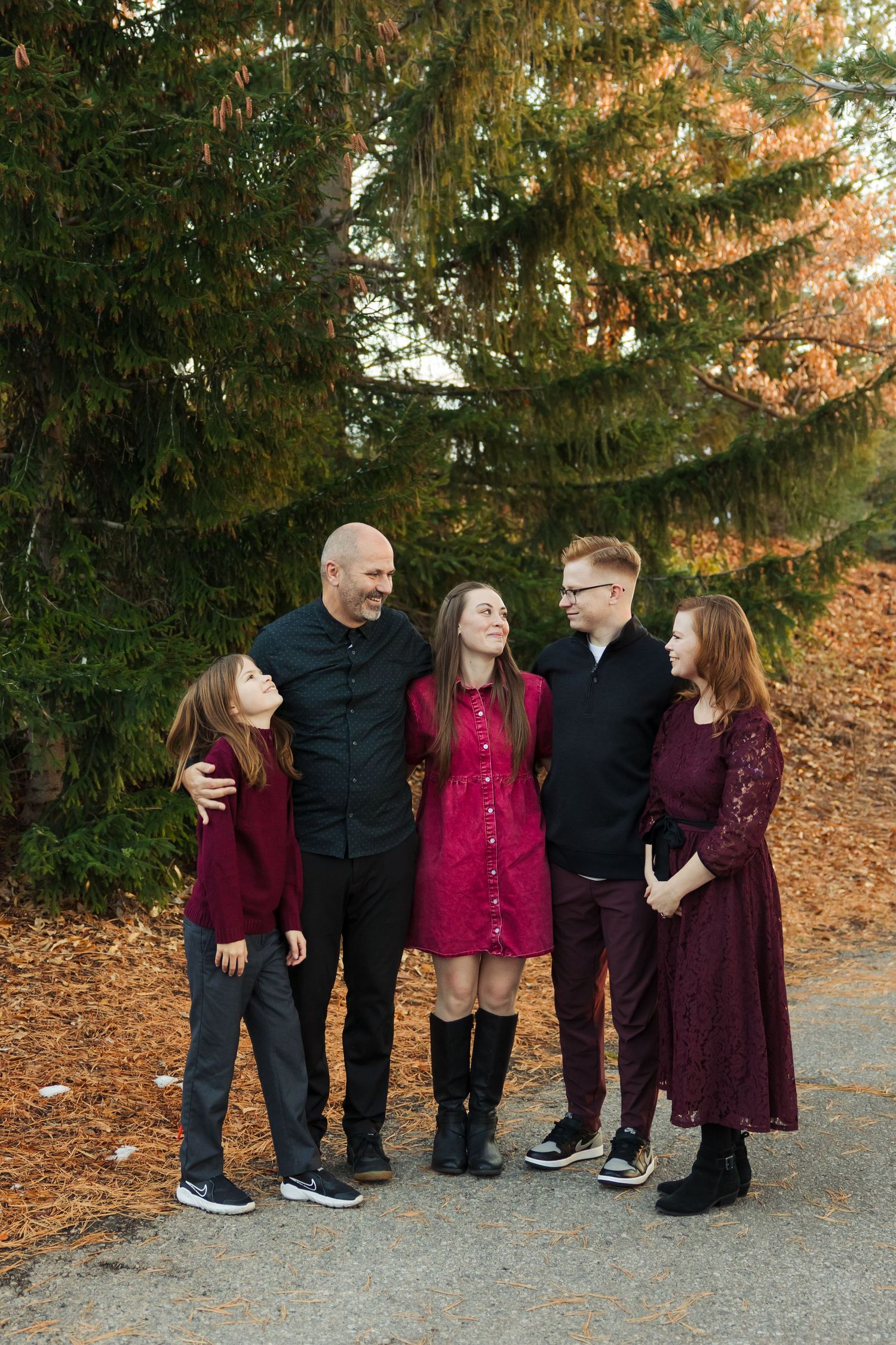 Family during fall at The Red Butte Gardens photography by Av Potter Photo a Utah wedding and lifestyle photographer