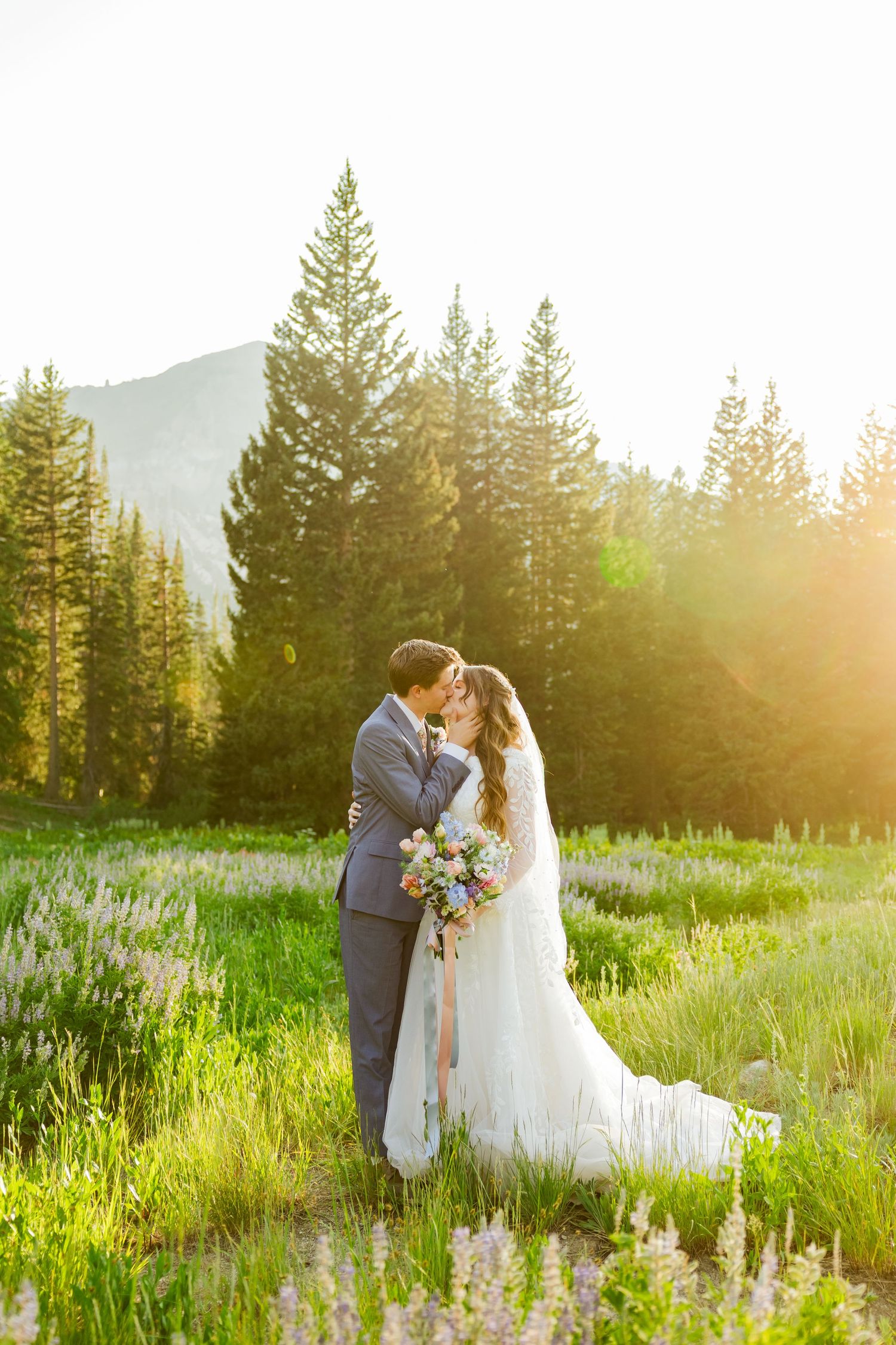 Bride and groom in flower field at Albion Basin photography by Av Potter Photo a Utah wedding and lifestyle photographer