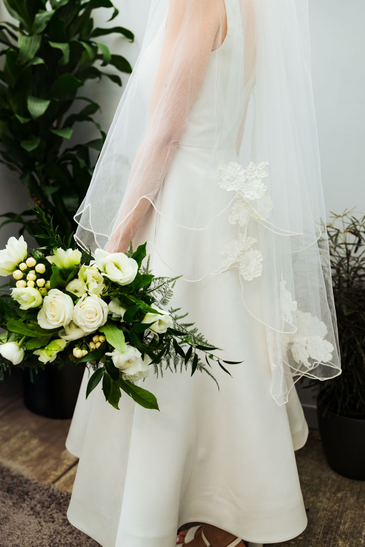 Bride holding bouquet at Cactus and Tropical in Salt Lake City photography by Av Potter Photo a Utah wedding and lifestyle photographer